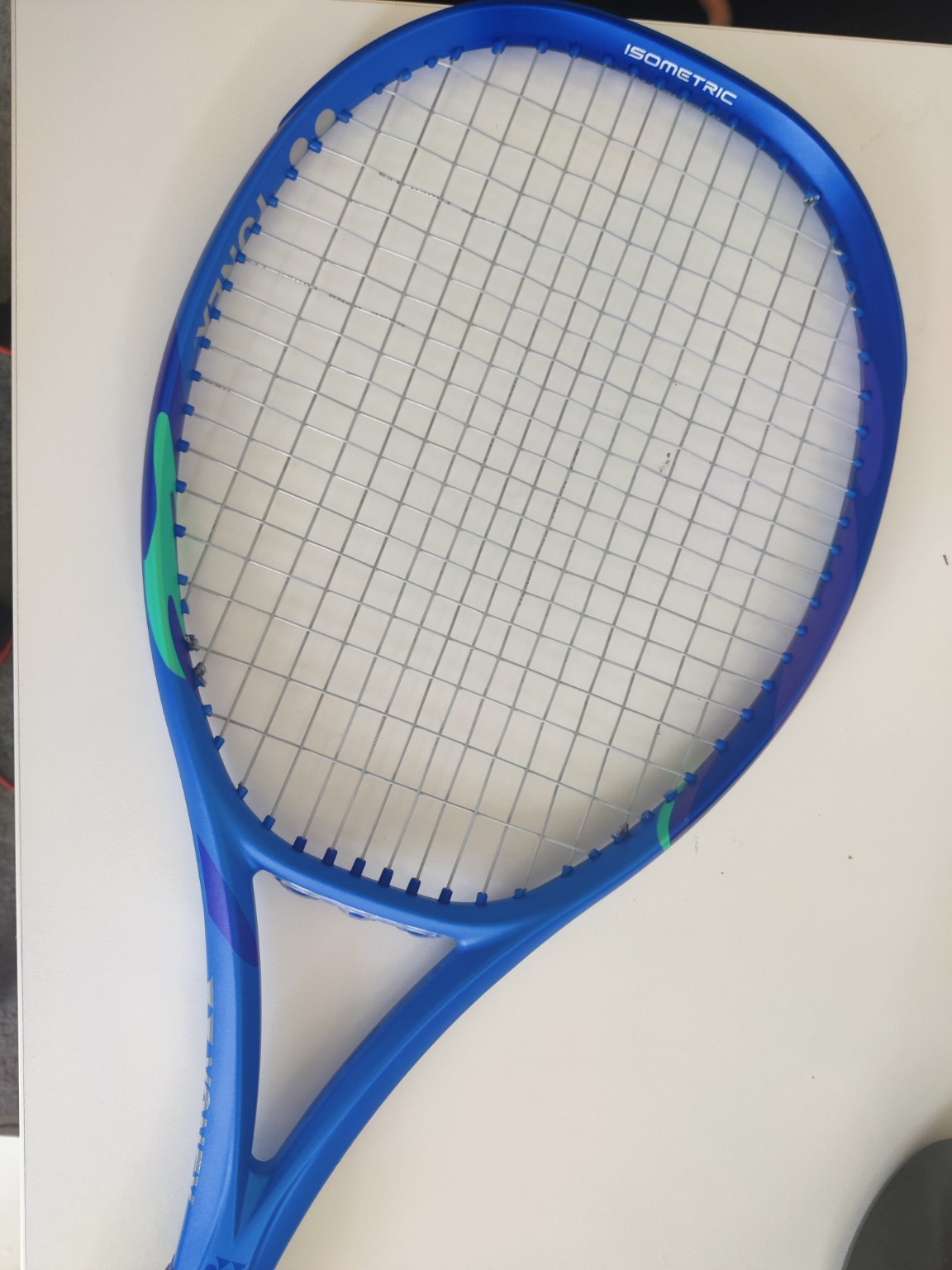 Close-up of a freshly restrung tennis racket